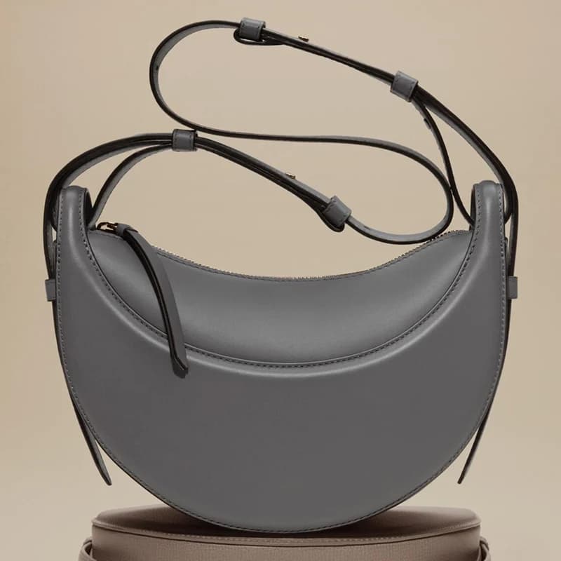 Sac à bandoulière pour femme en cuir véritable, style croissant, design original avec fermeture écla