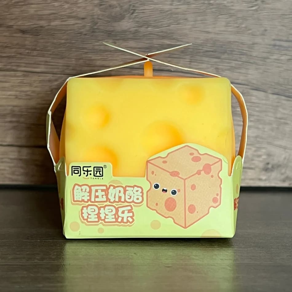 Balle anti-stress en plastique souple, faite à la main, en forme de fromage, à presser, à l'huile de